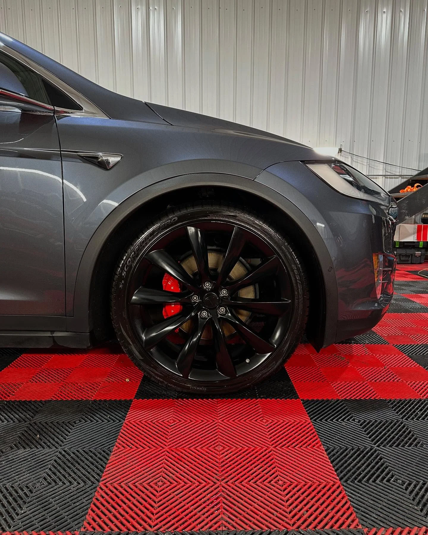 Model X wheel closeup car detailing Orchard Park NY - mirror finish