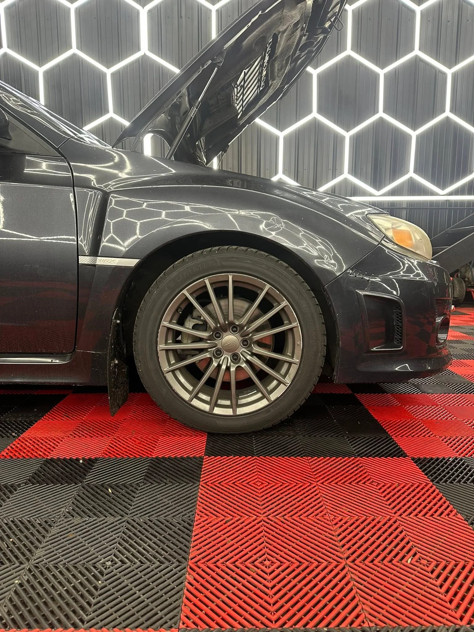 Performance car wheel well after salt removal - Buffalo NY winter detailing